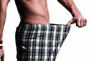 Man looks at the penis and wants to increase it